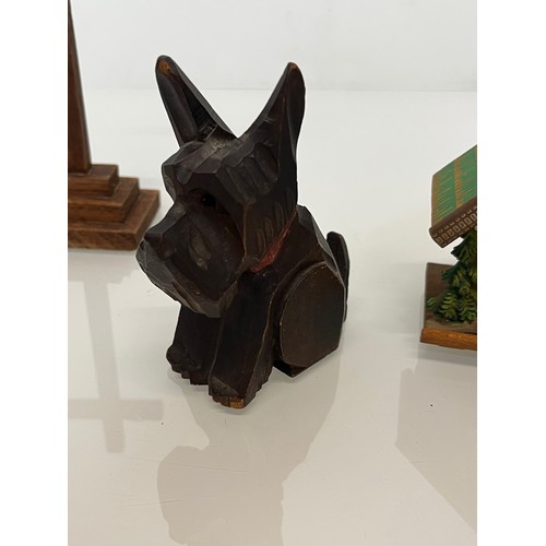 305 - Collection of souvenir treen, a Swiss musical box and barometer, a carved terrier dog pen stand and ... 