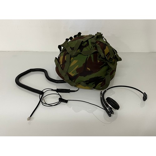 176 - Militaria, a late C20th British army helmet with coms system attached and a cased set of intensifyin... 