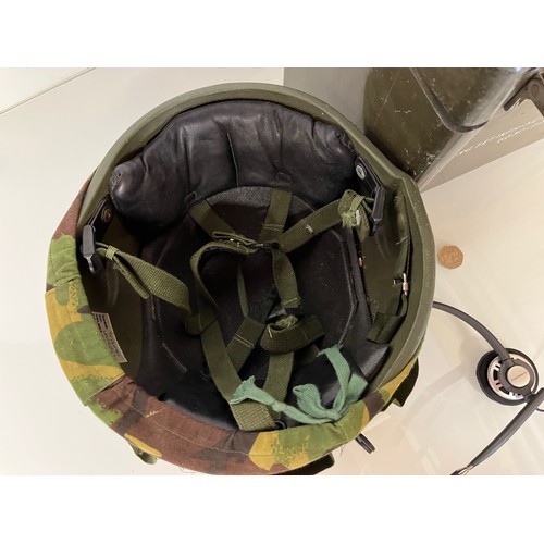 176 - Militaria, a late C20th British army helmet with coms system attached and a cased set of intensifyin... 