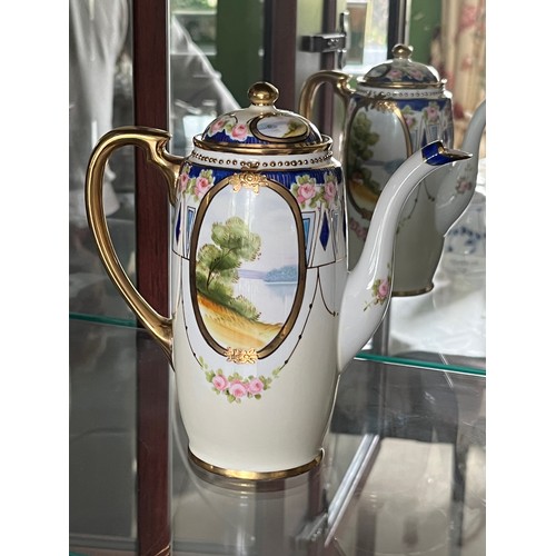 253 - Noritake teapot, gilded decoration and panels with painted landscapes.

This lot is available for in... 