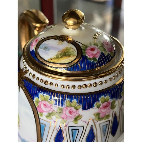 253 - Noritake teapot, gilded decoration and panels with painted landscapes.

This lot is available for in... 