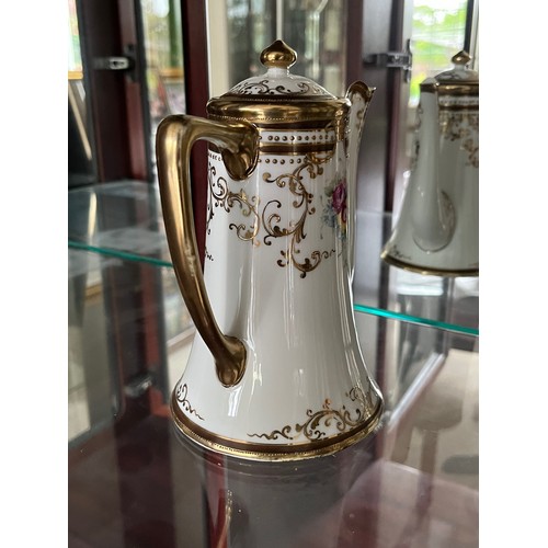 267 - Noritake fine porcelain teapot with gilded decoration.

This lot is available for in-house shipping