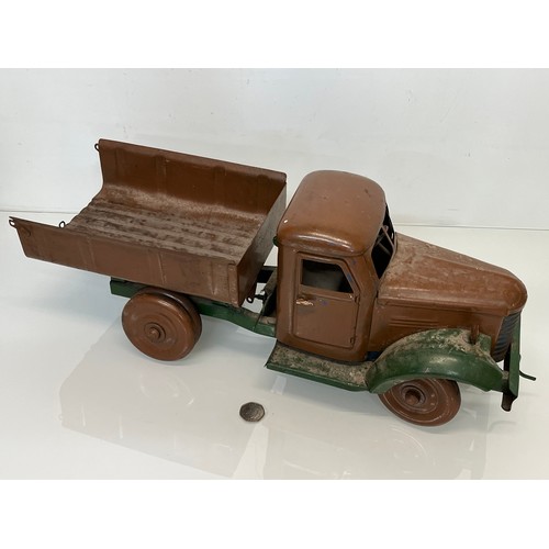 460 - Large tinplate toy truck, opening doors etc. 54 cm long.

This lot is available for in-house shippin... 