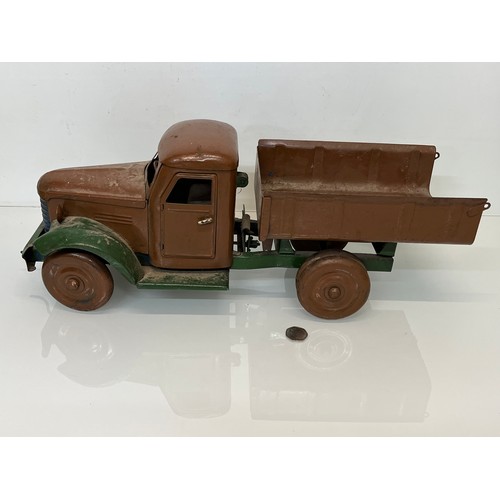 460 - Large tinplate toy truck, opening doors etc. 54 cm long.

This lot is available for in-house shippin... 