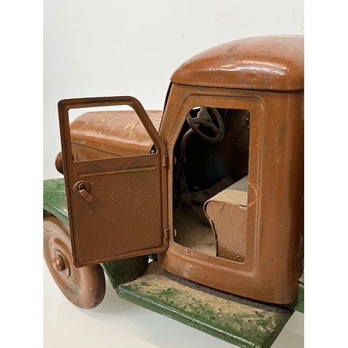 460 - Large tinplate toy truck, opening doors etc. 54 cm long.

This lot is available for in-house shippin... 