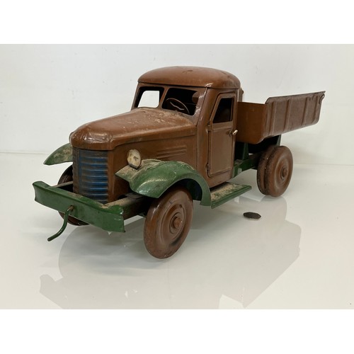 460 - Large tinplate toy truck, opening doors etc. 54 cm long.

This lot is available for in-house shippin... 