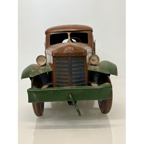 460 - Large tinplate toy truck, opening doors etc. 54 cm long.

This lot is available for in-house shippin... 