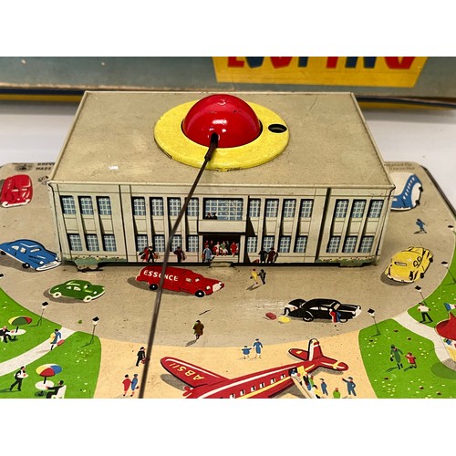 380 - Lithographed tinplate clock work model Airport with circling plane, in original box. 38 cm x 25 cm.
... 