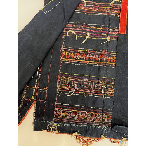 312 - Asian tribal art, an unusual antique jacket from a Hill tribe in Thailand, woven woollen body with d... 