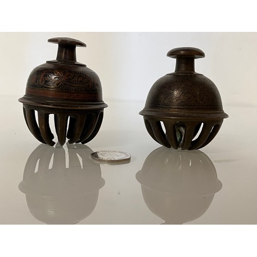 313 - Asian tribal art, two cast bronze and bells with hand chased and enamelled decoration.

This lot is ... 