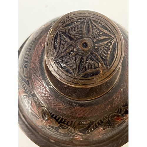 313 - Asian tribal art, two cast bronze and bells with hand chased and enamelled decoration.

This lot is ... 