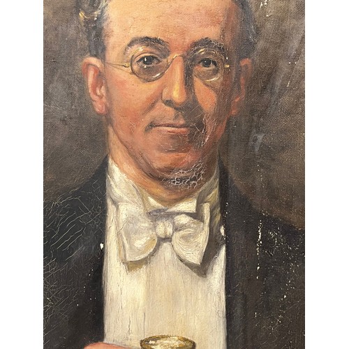 237 - Oil on canvas portrait of a man with a toasting glass signed c F Holman, the painting is affectionat... 