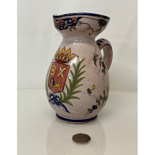 343 - Pottery jug with painted coat of arms to the front.
18 cm tall.
This lot is available for in-house s... 