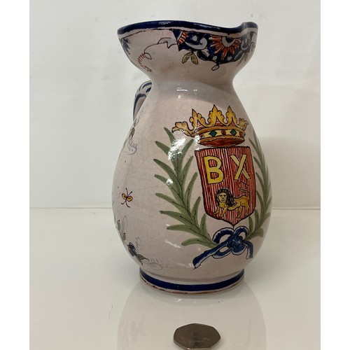 343 - Pottery jug with painted coat of arms to the front.
18 cm tall.
This lot is available for in-house s... 