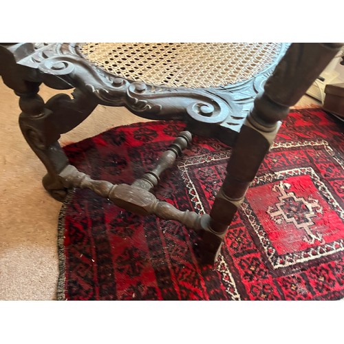 1 - Decorative antique furniture, a hand carved high backed armchair with a cane seat section and uphols... 