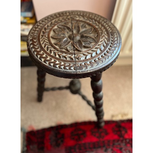 2 - Decorative furniture, a hand carved three legged stool, 32 cm diameter top 48 cm high.

This lot is ... 