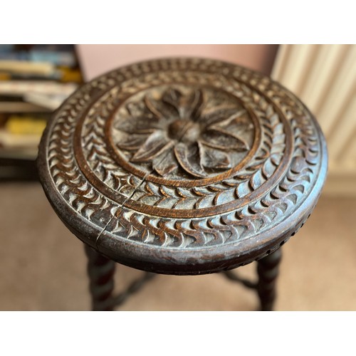 2 - Decorative furniture, a hand carved three legged stool, 32 cm diameter top 48 cm high.

This lot is ... 