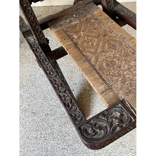 13 - Anglo Indian folding chair with carved decoration.

This lot is collection only