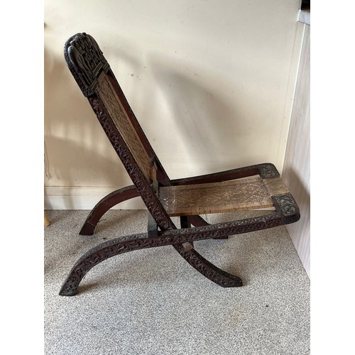 13 - Anglo Indian folding chair with carved decoration.

This lot is collection only