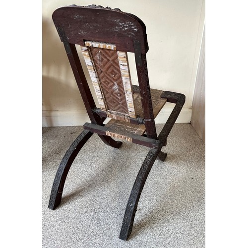 13 - Anglo Indian folding chair with carved decoration.

This lot is collection only