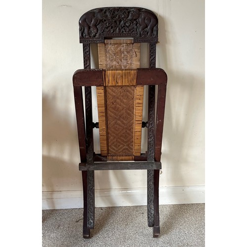 13 - Anglo Indian folding chair with carved decoration.

This lot is collection only