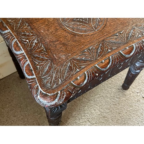 16 - A hand caved side table with an oak top, 35 cm x 29 cm x 38 cm high.

This lot is available for in-h... 