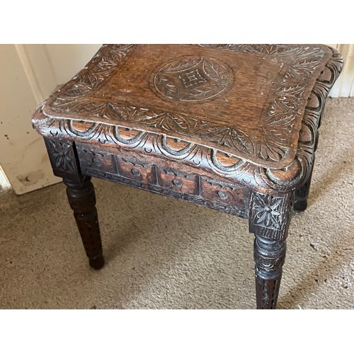 16 - A hand caved side table with an oak top, 35 cm x 29 cm x 38 cm high.

This lot is available for in-h... 