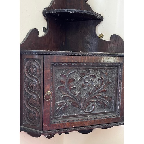 18 - Oak corner cupboard with carved decoration, 

This lot is collection only