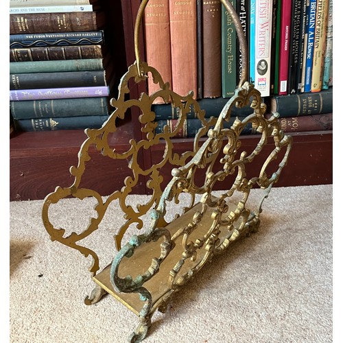 19 - Metal magazine rack with cast brass sides, 44 cm long x 47 cm high.

This lot is collection only