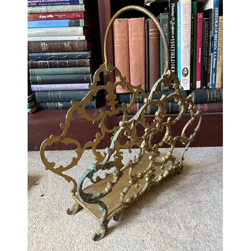 19 - Metal magazine rack with cast brass sides, 44 cm long x 47 cm high.

This lot is collection only