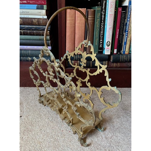 19 - Metal magazine rack with cast brass sides, 44 cm long x 47 cm high.

This lot is collection only