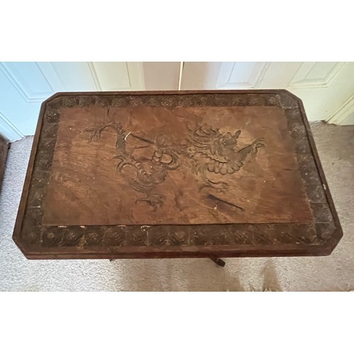 21 - A two tier side table with carved Chinoserie decoration of a Dragon and Turtles, 41 cm x 26 cm x 51.... 