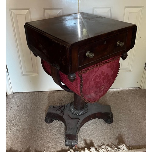 22 - A drop leaf mahogany sewing table raised on a single column base, and with a faux drawer to the rear... 