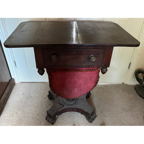 22 - A drop leaf mahogany sewing table raised on a single column base, and with a faux drawer to the rear... 