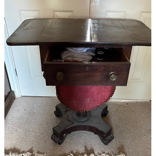 22 - A drop leaf mahogany sewing table raised on a single column base, and with a faux drawer to the rear... 