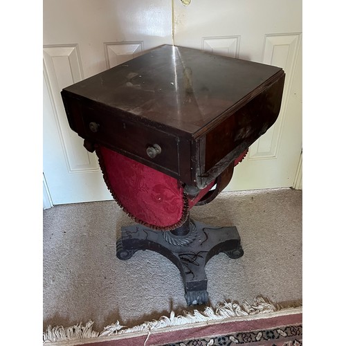 22 - A drop leaf mahogany sewing table raised on a single column base, and with a faux drawer to the rear... 