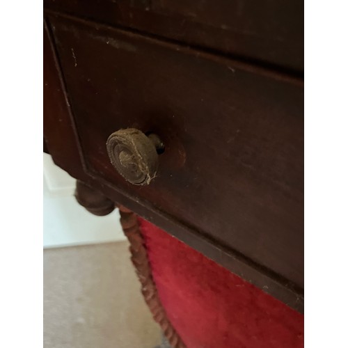 22 - A drop leaf mahogany sewing table raised on a single column base, and with a faux drawer to the rear... 