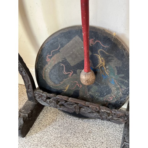 33 - Floor standing gong decorated with a dragon on a carved support.

This lot is collection only