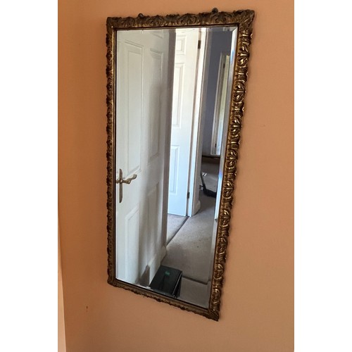 38 - A bevel edged gilt framed wall mirror, 44 cm x 98 cm.

This lot is collection only