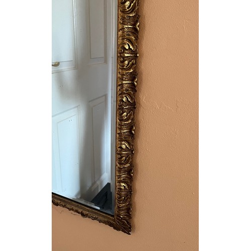 38 - A bevel edged gilt framed wall mirror, 44 cm x 98 cm.

This lot is collection only