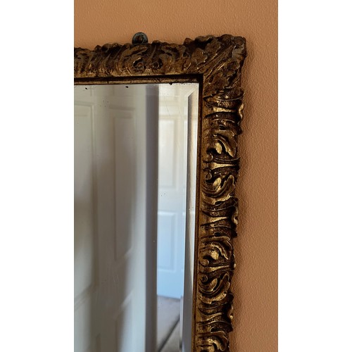 38 - A bevel edged gilt framed wall mirror, 44 cm x 98 cm.

This lot is collection only