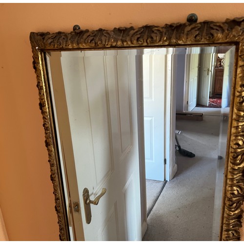 38 - A bevel edged gilt framed wall mirror, 44 cm x 98 cm.

This lot is collection only