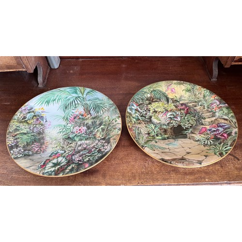 40 - A pair of hand decorated plates floral garden scenes by George H Dewsberry 1915,  29 cm in diameter.... 