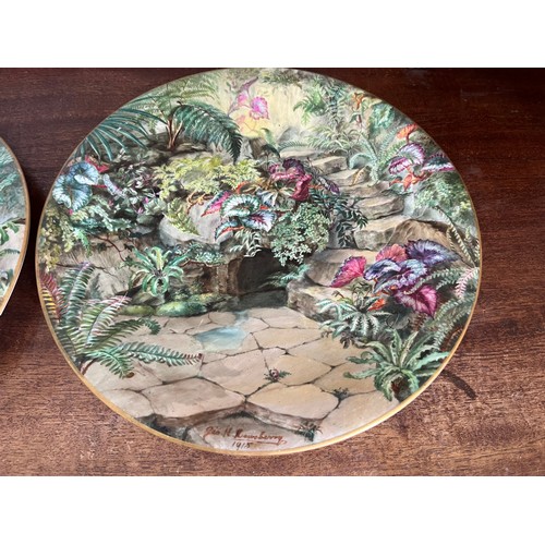 40 - A pair of hand decorated plates floral garden scenes by George H Dewsberry 1915,  29 cm in diameter.... 