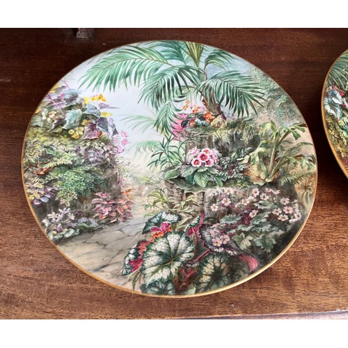 40 - A pair of hand decorated plates floral garden scenes by George H Dewsberry 1915,  29 cm in diameter.... 