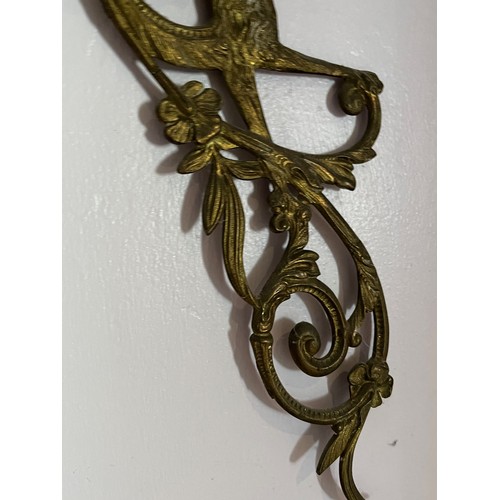 46 - Two cast brass decorative sections featuring winged creatures, each is 30 cm  x 14 cm.

This lot is ... 