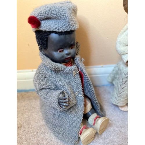 48 - Vintage dolls, unusual black doll wearing Amanda Jane hat and coat, and four other dolls.

This lot ... 