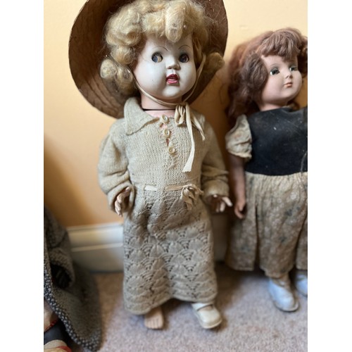 48 - Vintage dolls, unusual black doll wearing Amanda Jane hat and coat, and four other dolls.

This lot ... 