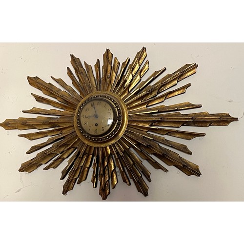 55 - Sunburst wall clock 80 cm wide.

This lot is collection only