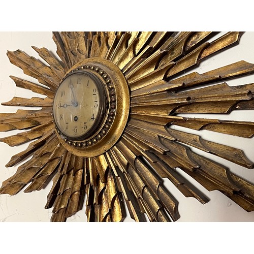 55 - Sunburst wall clock 80 cm wide.

This lot is collection only